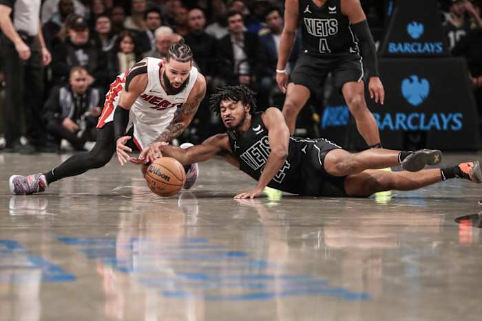 Miami Heat forward Caleb Martin (16) and Brooklyn Nets guard Cam Thomas (24)